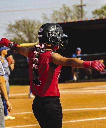 BASE HIT - Levelland Loboette Saydi Mendez celebrated with her team as she was able to get on third base during the team’s game against the Lake View Chiefs last Friday. Mendez finished with three runs and two walks in the game. (Staff photo by Aalijah Soliz)