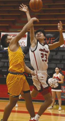 GLASS WORK- Zameron Lecroy battled for a rebound in a 47-37 Levelland Lobo home loss to the Seminole Indians last Friday in UIL high school boys’ basketball action. Lecroy had seven points in the effort. The Lobos will host Sweetwater at 7:30 p.m. on Friday. (Photo by Jay Kelley.)