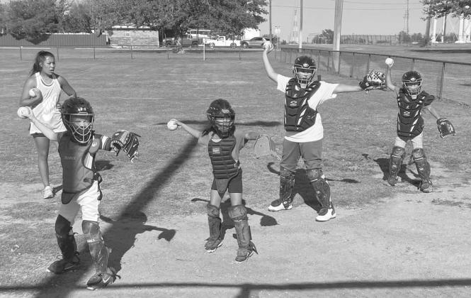 FUNDAMENTALS - Former Levelland Loboette standout Chloe Constantino helped the Levelland Youth Softball League by teaching the girls how to throw a softball along with the basics of catching. Chloe taught the kids her experienced lessons as well as beginners lessons for the newer kids who are interested in playing softball. The Levelland Youth Softball League has continued to grow in numbers throughout the past three seasons under Jacob Tucker and his board. (Photo courtesy of Levelland Youth Softball)