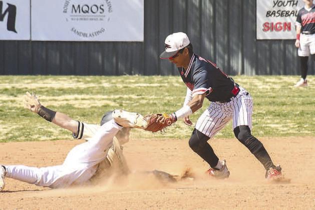 TAG- Levelland Lobo defeated Bushland at home Monday afternoon, 7-5. Pictured is Lobo Noah Tienda tagging a Bushland runner. Levelland will host Tulia Tuesday, March 21st. (Staff Photo by Dom Puente)