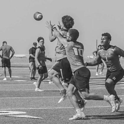 CONTESTED CATCH - Ropes Eagle Malikai Mendez made the tough catch in traffic during the team’s 7 on 7 game in New Home against the Snyder Tigers this past Monday. (Staff photo by Aalijah Soliz)