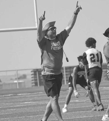 PLAYCALLING - Ropes Head Football Coach Beau Riker called plays form behind his quarterback during the team’s 7 on 7 game against Snyder this past Monday in New Home. (Staff photo by Aalijah Soliz)