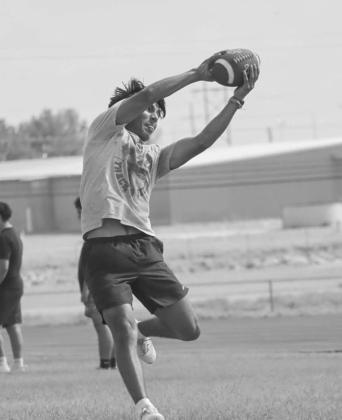 ACROBATIC CATCH - Levelland Lobo Noah Tienda twisted in the air to catch the ball during the team’s summer workouts this past week at the Levelland High School. (Staff photo by Aalijah Soliz)